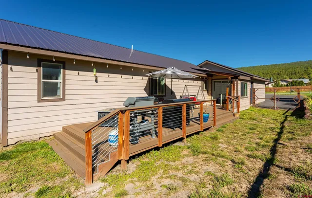 a view of a house with wooden fence