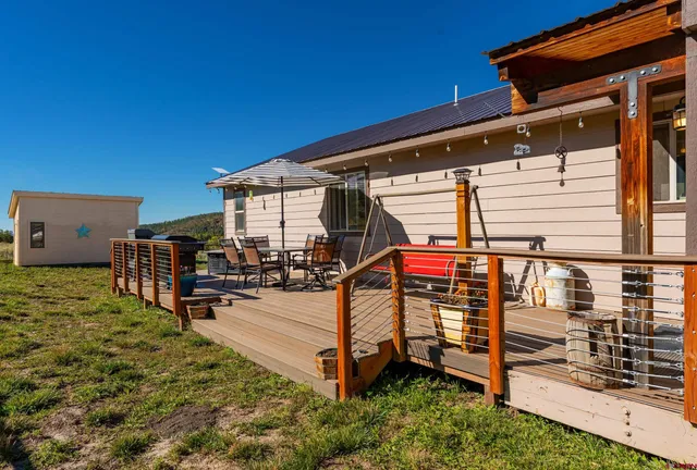 a view of a backyard with sitting area