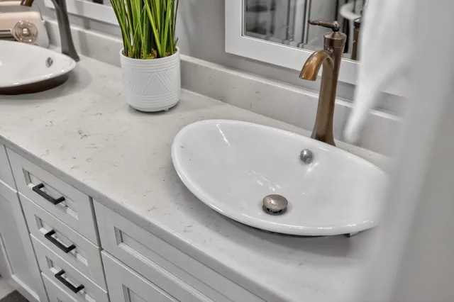 a spacious bedroom with a bed and a window