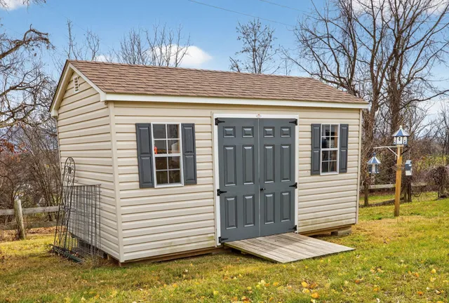 a view of a house with a yard covered with snow