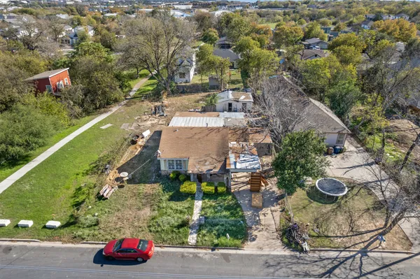 an aerial view of a house with outdoor space