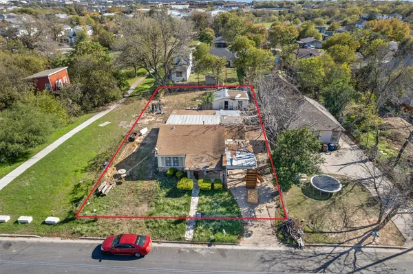 an aerial view of a house with a garden
