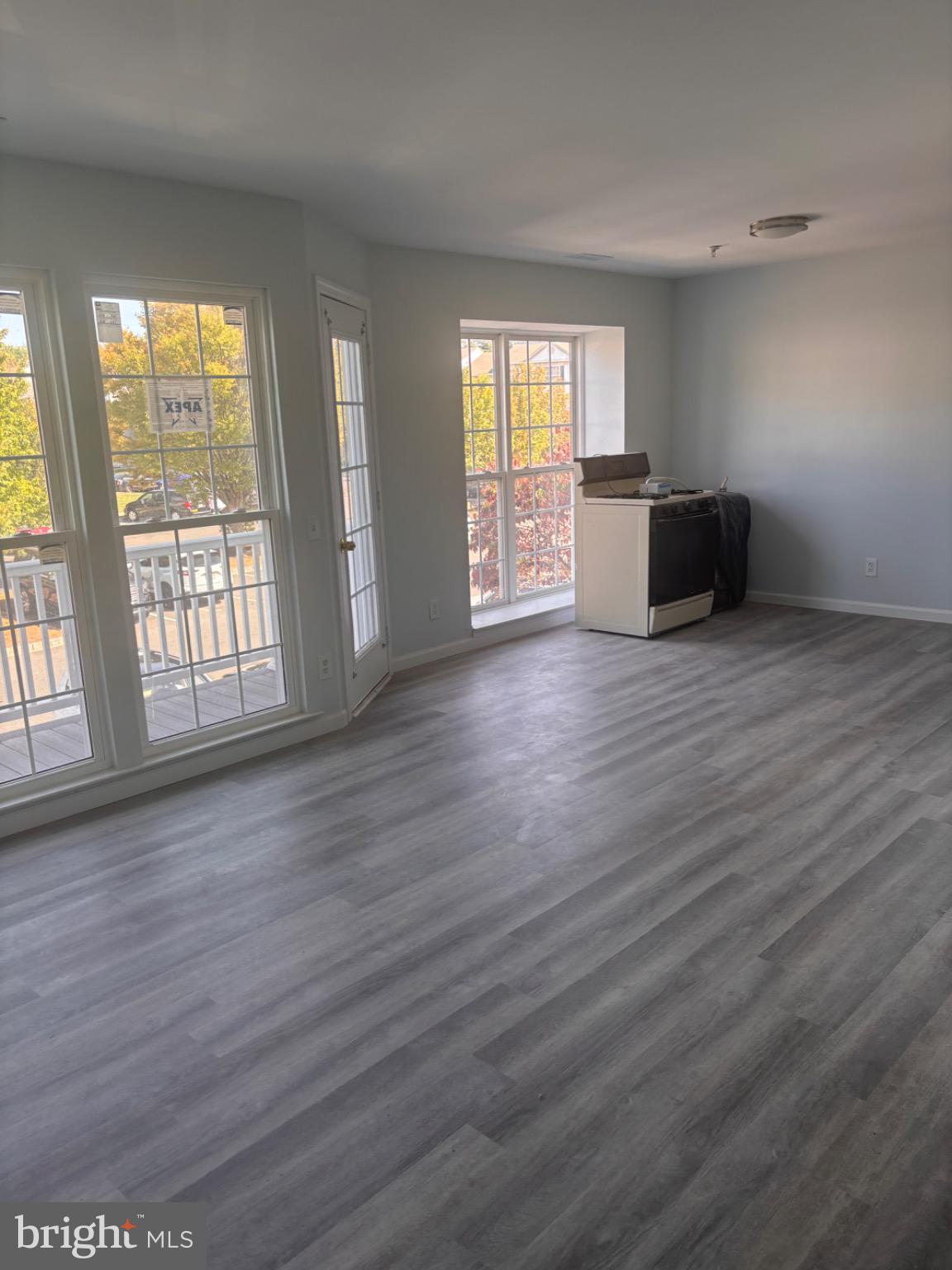 265 Rosebay Court Delran, NJ 08075 - Photo 12 of 17 an empty room with wooden floor and windows