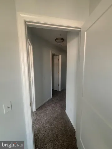 a view of a hallway with closet