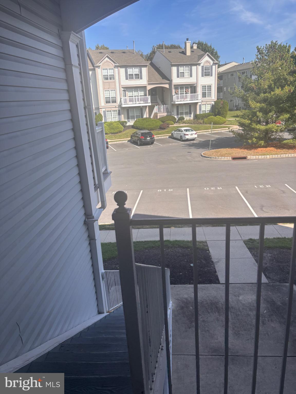 265 Rosebay Court Delran, NJ 08075 - Photo 4 of 17 a view of balcony with two chairs and wooden floor