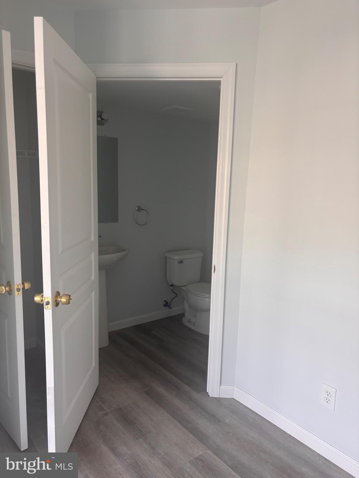 265 Rosebay Court Delran, NJ 08075 - Photo 5 of 17 a view of a bathroom with a hardwood floor and a toilet