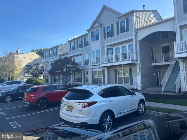 a front view of a house with parking space
