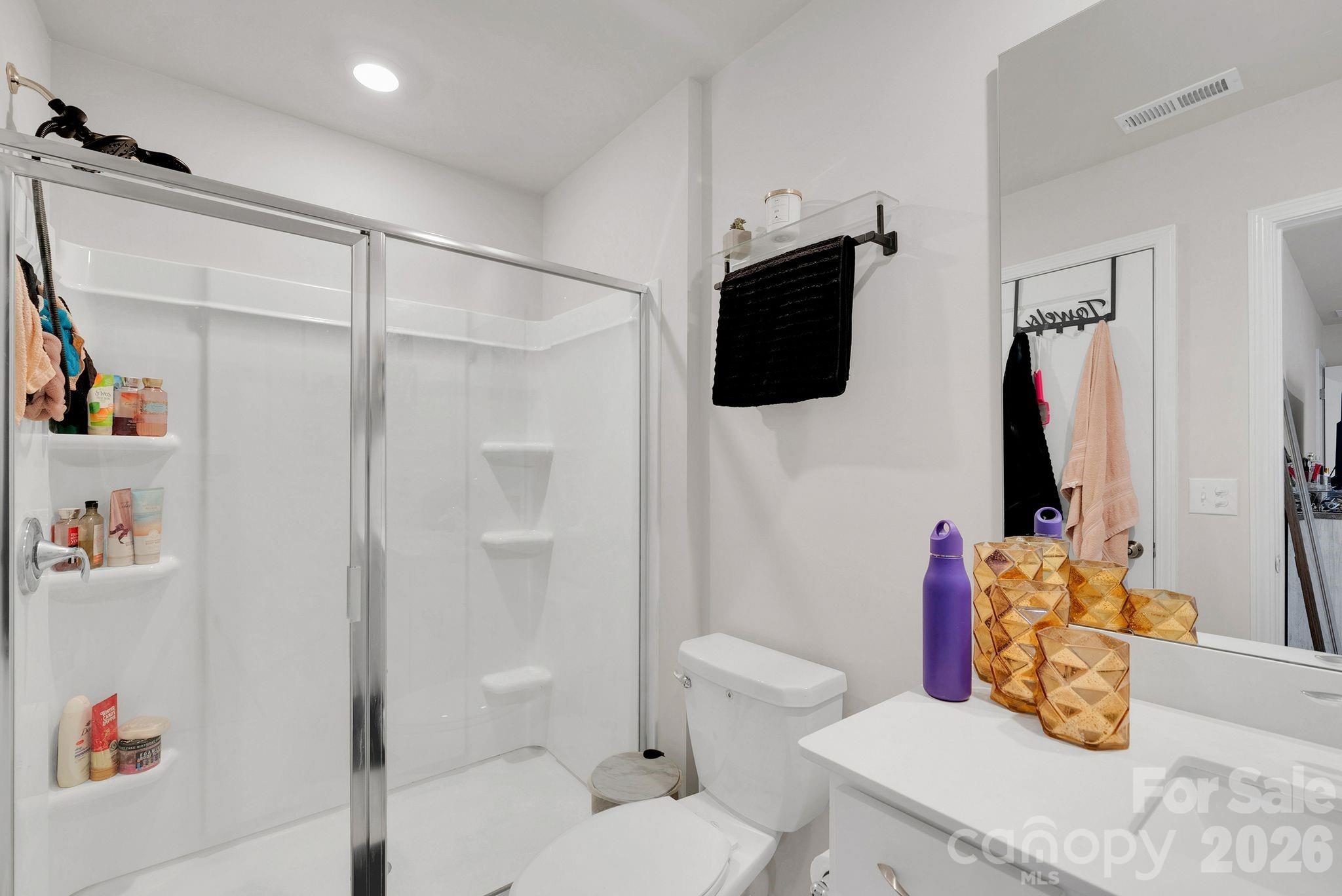 224 Hamptons Cove Road Troutman, NC 28166 - Photo 37 of 47 a bathroom with a sink toilet and shower