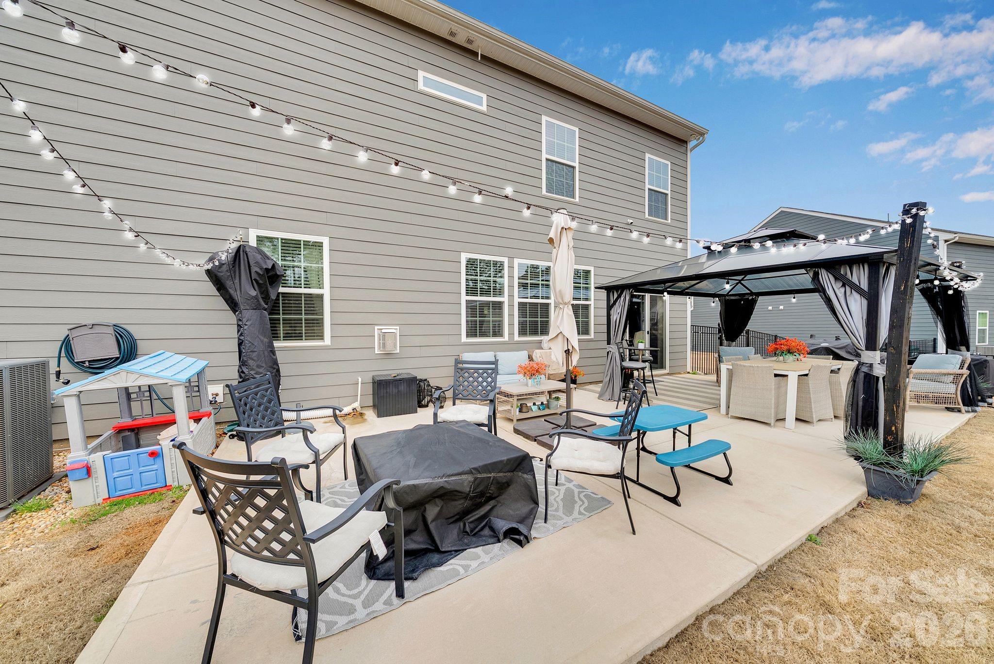 224 Hamptons Cove Road Troutman, NC 28166 - Photo 43 of 47 a backyard of a house with seating space