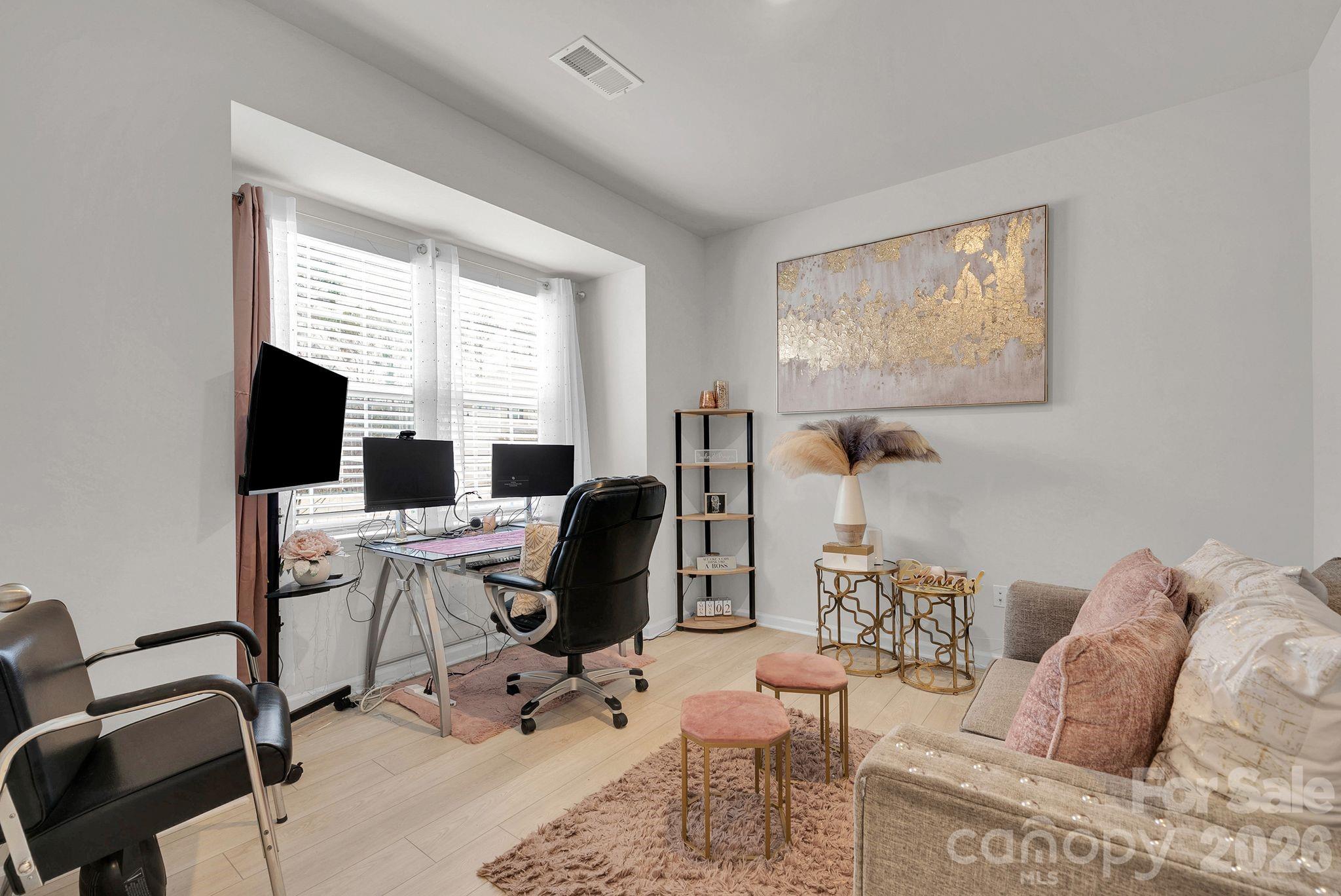 224 Hamptons Cove Road Troutman, NC 28166 - Photo 5 of 47 a view of a workspace with furniture and a window