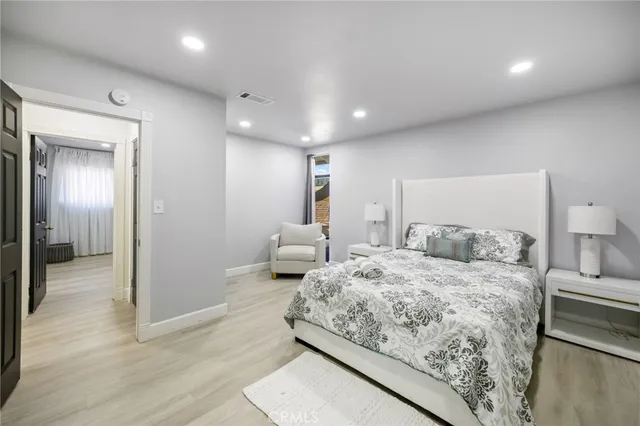 a bedroom with a bed and a view of bathroom