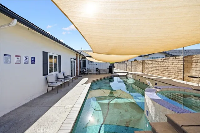 a view of a patio with couches and table tennis pool