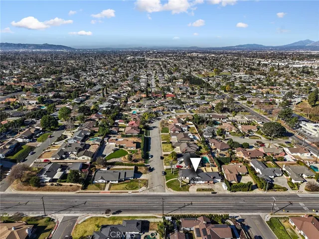 an aerial view of residential house and sandy dunes