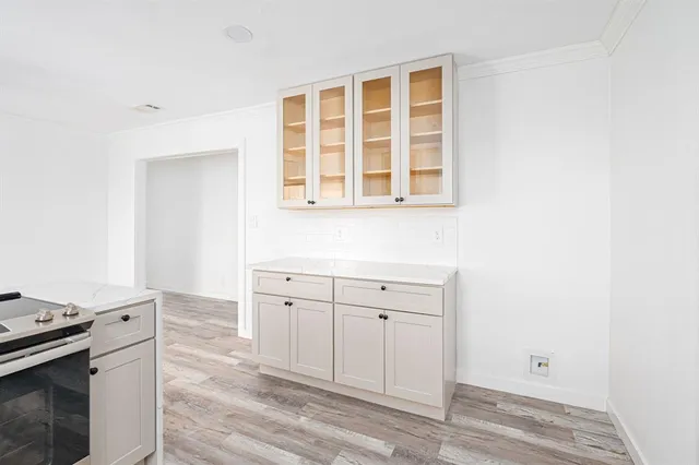 a room with a stove and a window