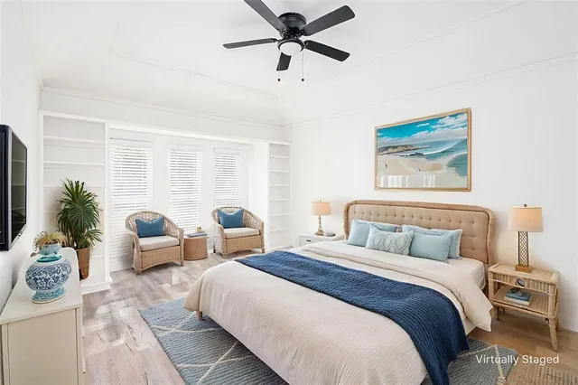 a spacious bedroom with two beds and a couch