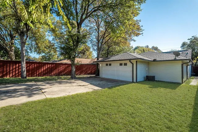 a view of a yard with large tree