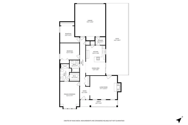 an aerial view of a house with yard