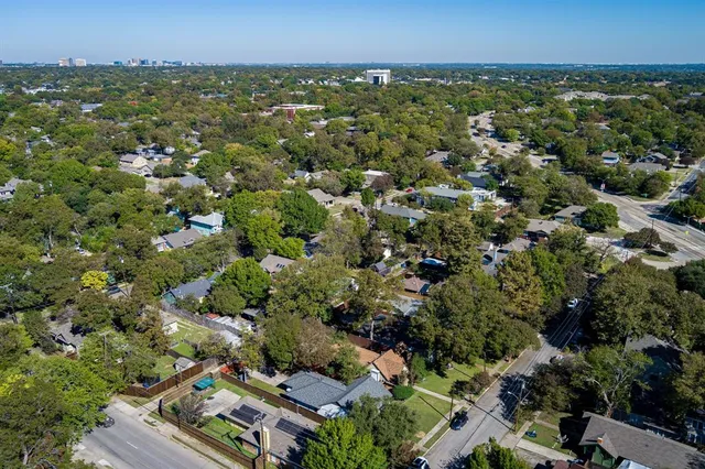 an aerial view of residential building and green space