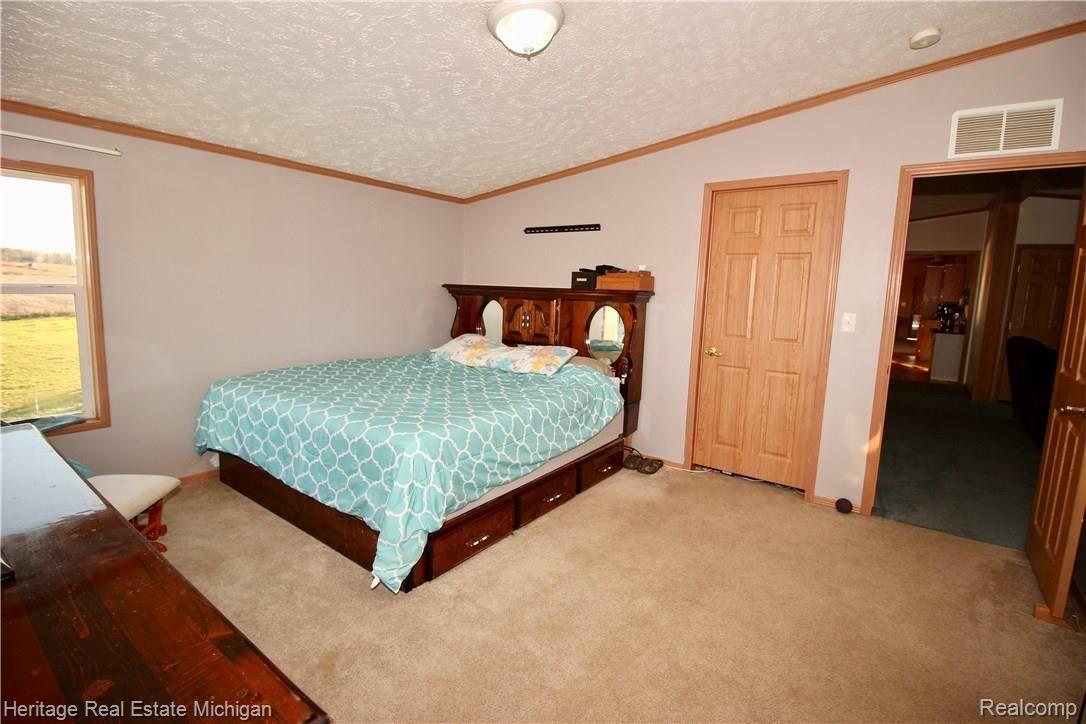 10550 East Prior Road Gaines, MI 48436 - Photo 14 of 28 Master Suite