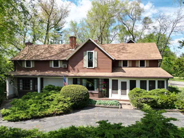 a kitchen with stainless steel appliances granite countertop a refrigerator a sink dishwasher a stove with wooden cabinets and floor