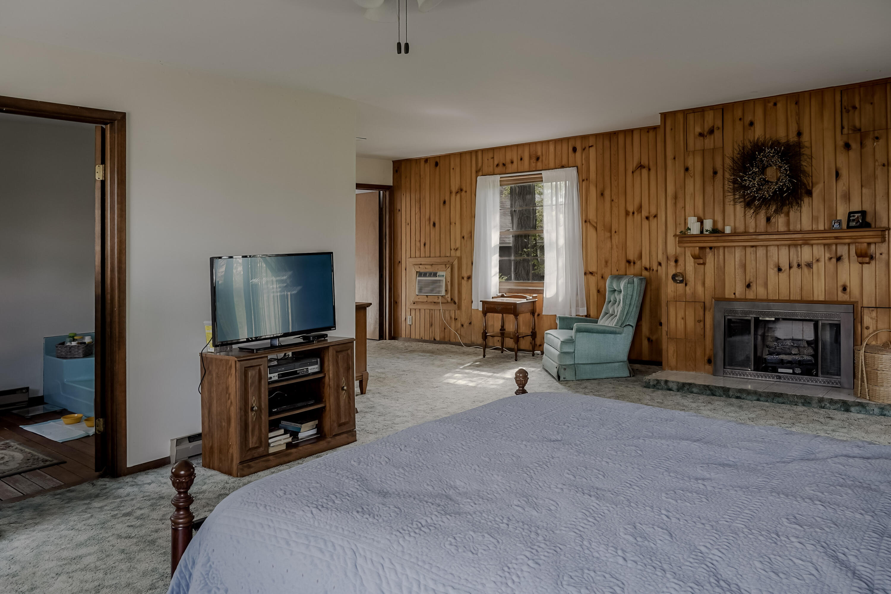 9014 East 129th Avenue Crown Point, IN 46307 - Photo 13 of 56 a room with furniture and a flat screen tv