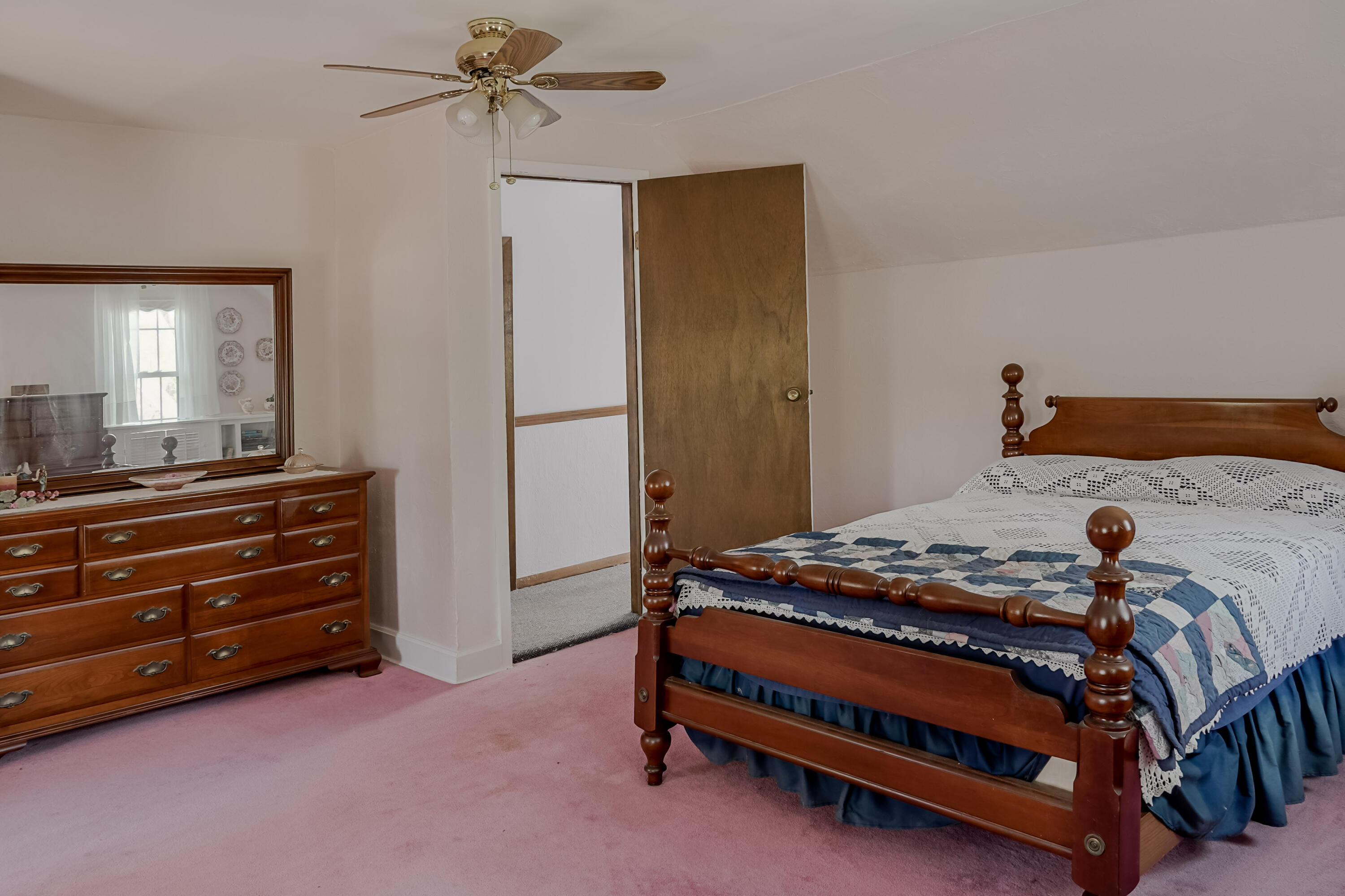 9014 East 129th Avenue Crown Point, IN 46307 - Photo 15 of 56 a bedroom with a bed and a dresser