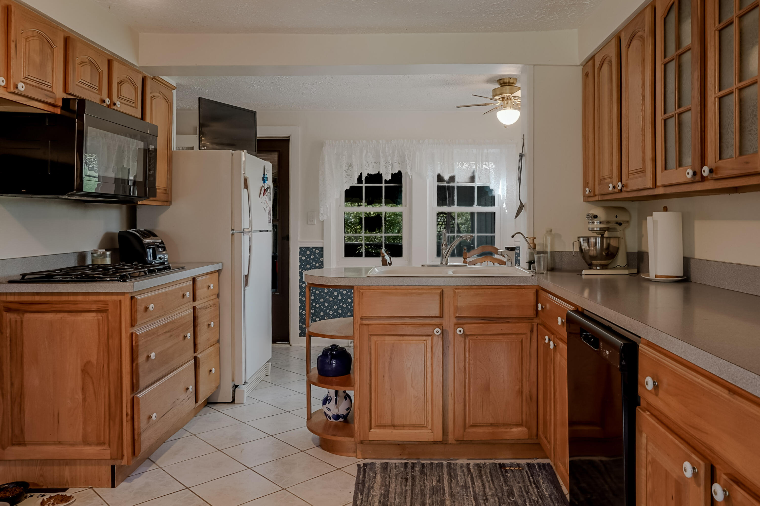 9014 East 129th Avenue Crown Point, IN 46307 - Photo 2 of 56 a kitchen with stainless steel appliances granite countertop a refrigerator a sink dishwasher a stove with wooden cabinets and floor