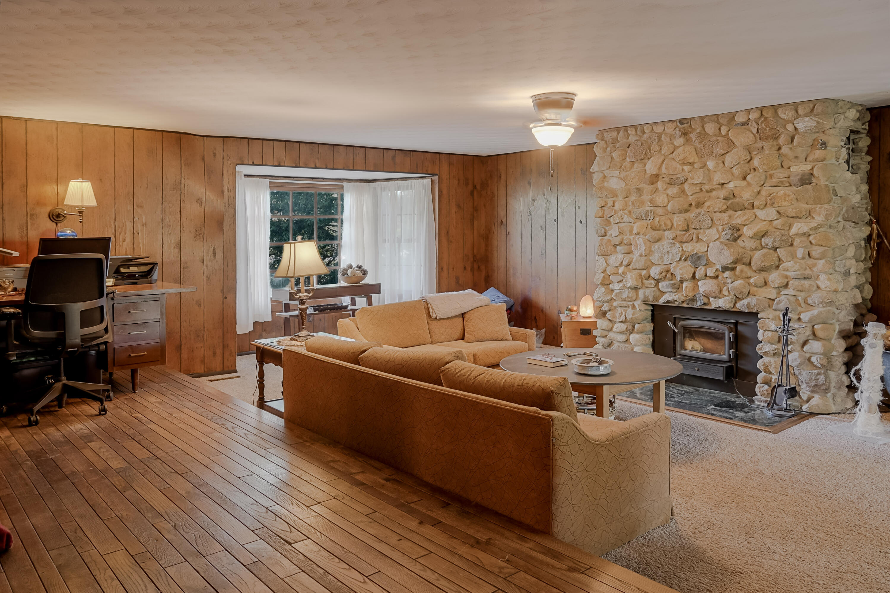 9014 East 129th Avenue Crown Point, IN 46307 - Photo 30 of 56 a living room with furniture and a fireplace