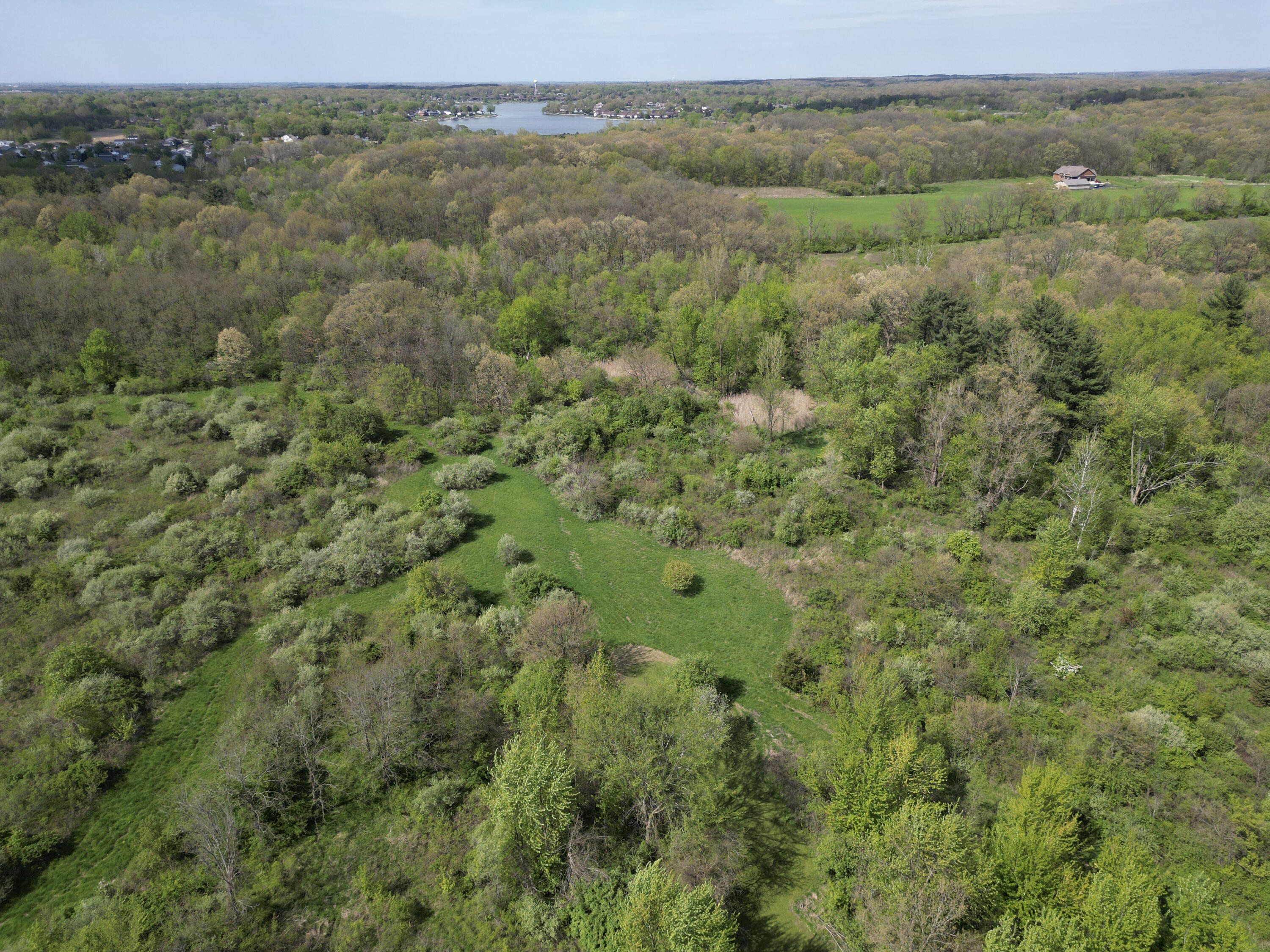 9014 East 129th Avenue Crown Point, IN 46307 - Photo 52 of 56 a view of a green field with lots of bushes