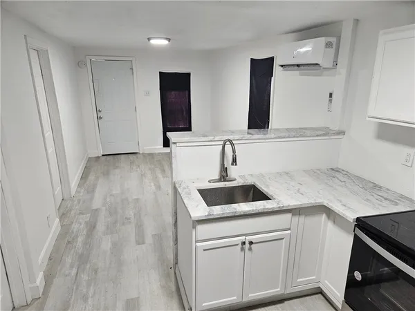 a kitchen with a sink and cabinets