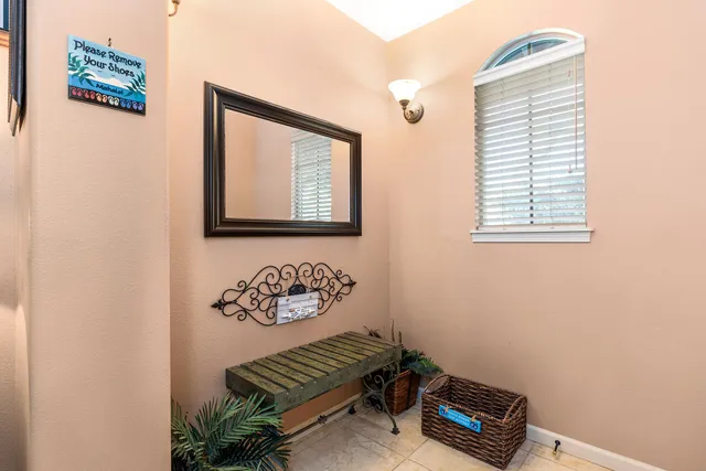 a view of room with a piano and wooden floor