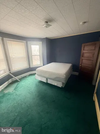 a room with a bed and a window