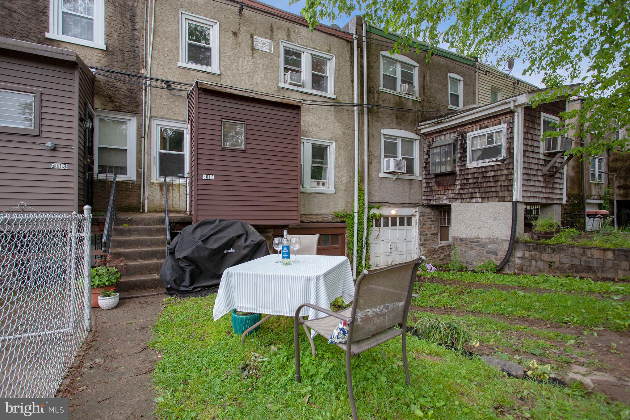 5015 Copley Road Philadelphia, PA 19144 - Photo 29 of 29 Backyard and driveway to garage