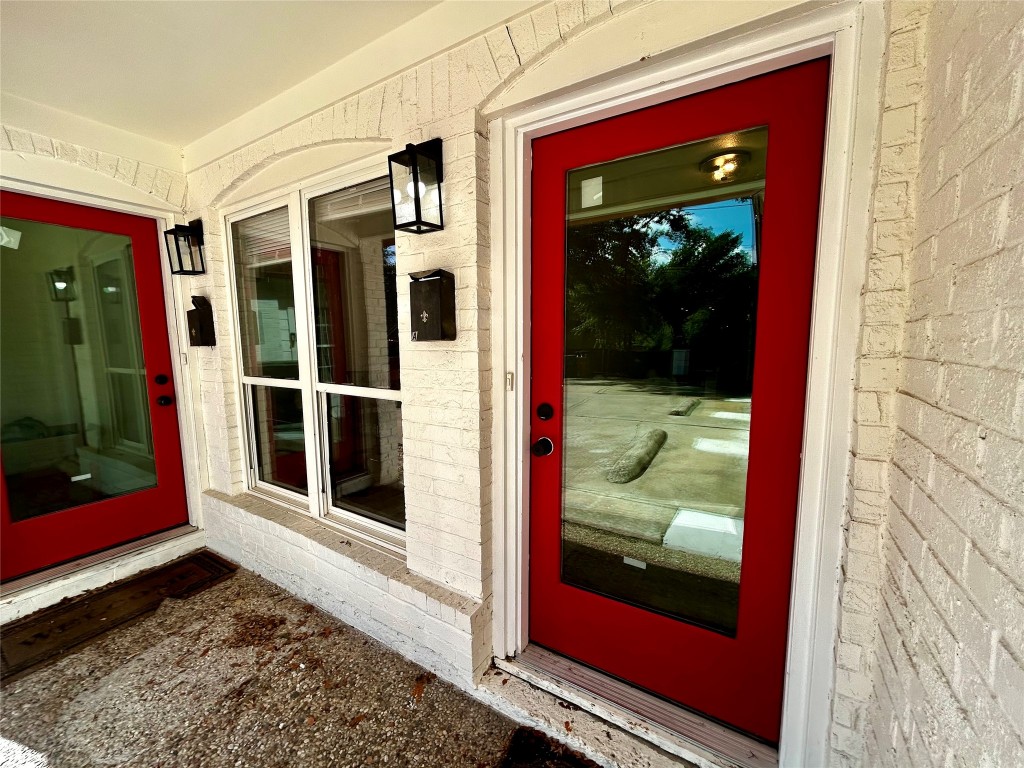 1005 West Martin Luther King Jr Boulevard Austin, TX 78701 - Photo 1 of 31 Doorway to property featuring brick siding