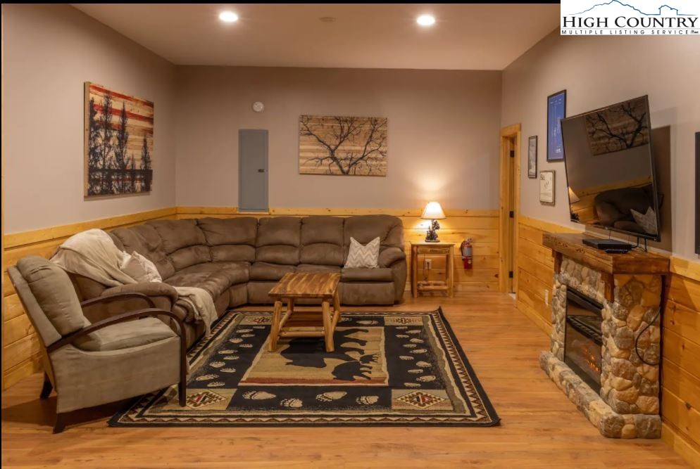 124 Aster Trail Beech Mountain, NC 28604 - Photo 12 of 26 a living room with furniture and a flat screen tv