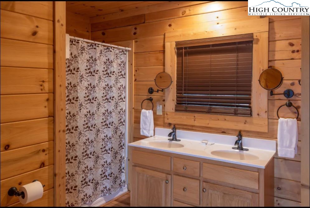 124 Aster Trail Beech Mountain, NC 28604 - Photo 16 of 26 a bathroom with a sink and a mirror