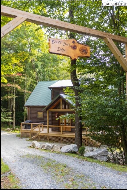 124 Aster Trail Beech Mountain, NC 28604 - Photo 22 of 26 a view of house with a yard