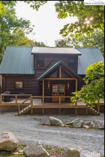 124 Aster Trail Beech Mountain, NC 28604 - Photo 23 of 26 a front view of a house with a yard