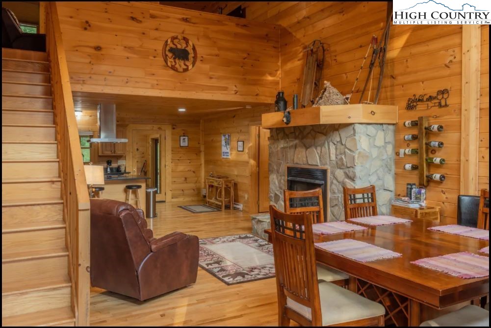 124 Aster Trail Beech Mountain, NC 28604 - Photo 5 of 26 a living room with furniture a fireplace and a table