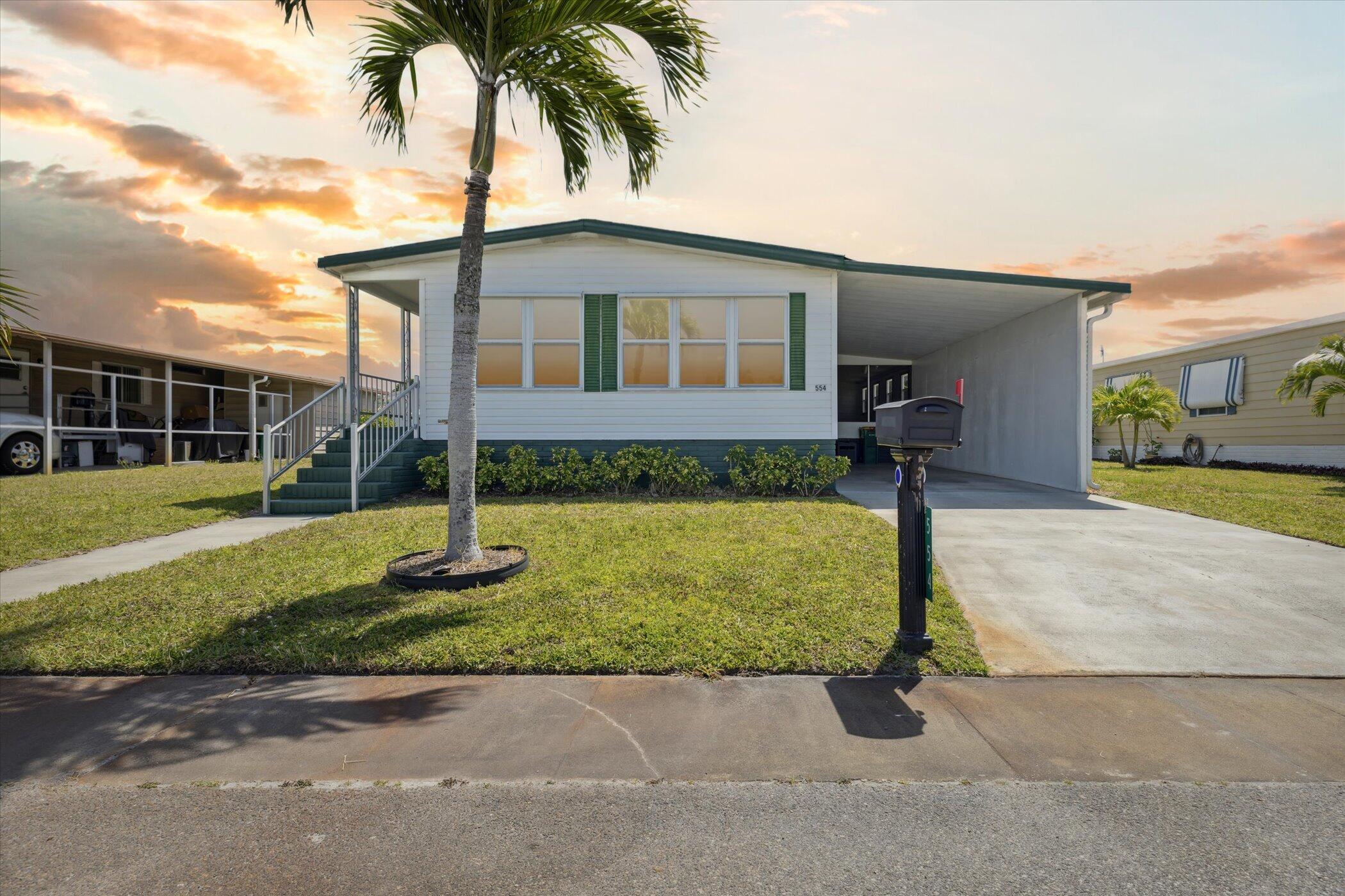 554 Ruth Circle Melbourne, FL 32904 - Photo 1 of 36 a front view of a house with garden