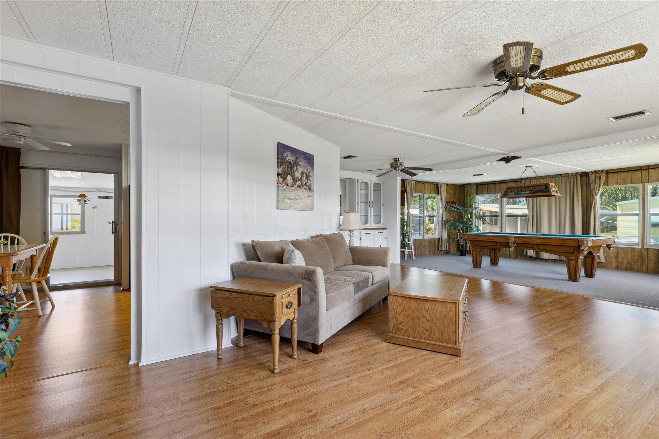 554 Ruth Circle Melbourne, FL 32904 - Photo 11 of 36 a living room with furniture and a wooden floor