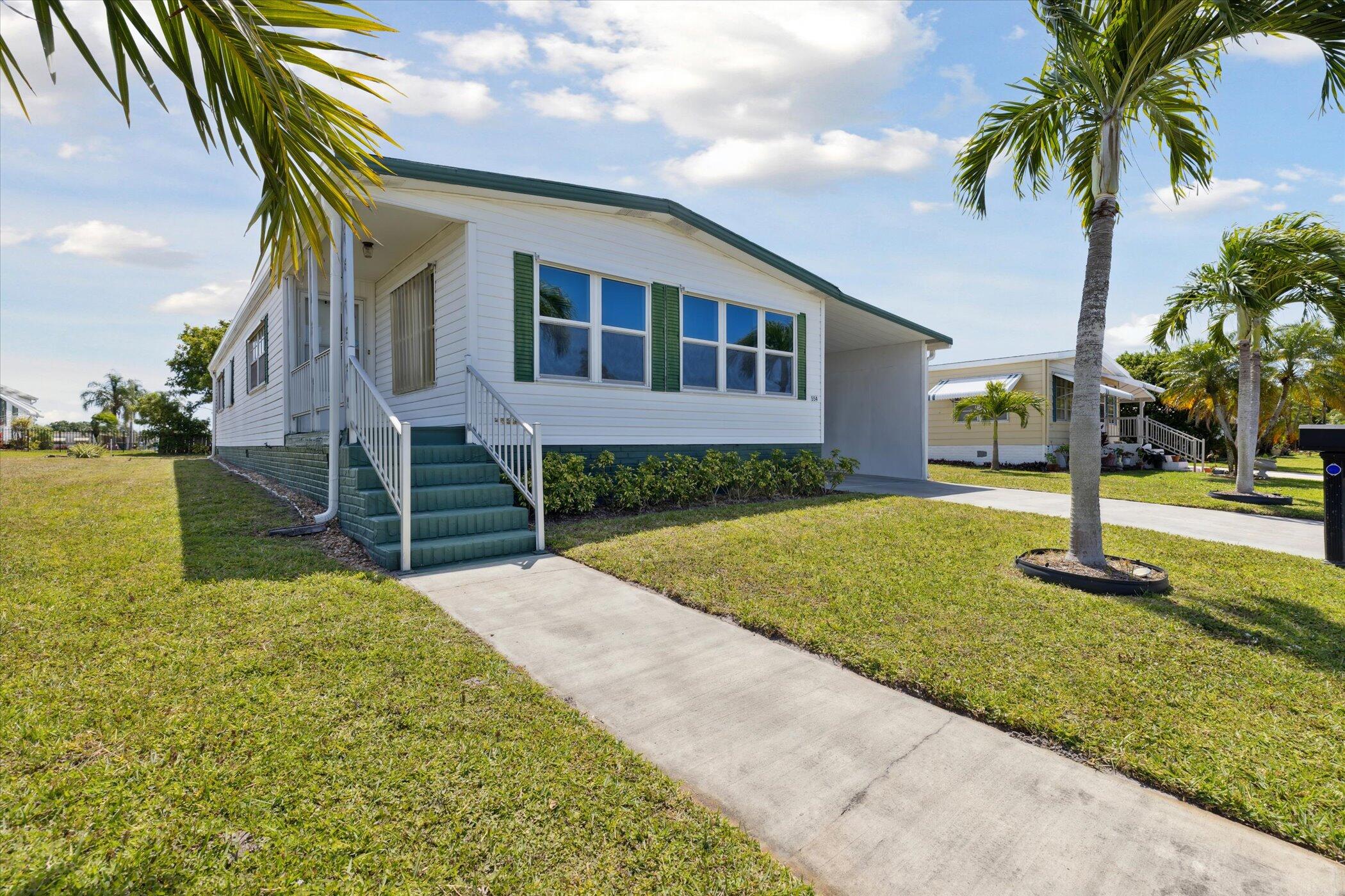 554 Ruth Circle Melbourne, FL 32904 - Photo 2 of 36 a front view of a house with garden