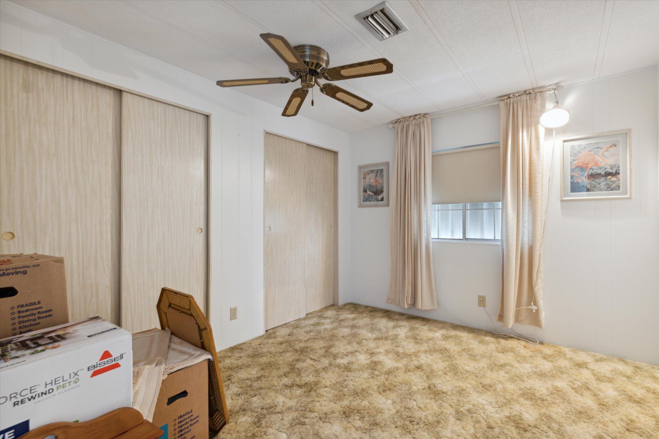 554 Ruth Circle Melbourne, FL 32904 - Photo 25 of 36 a bedroom with a bed and a window