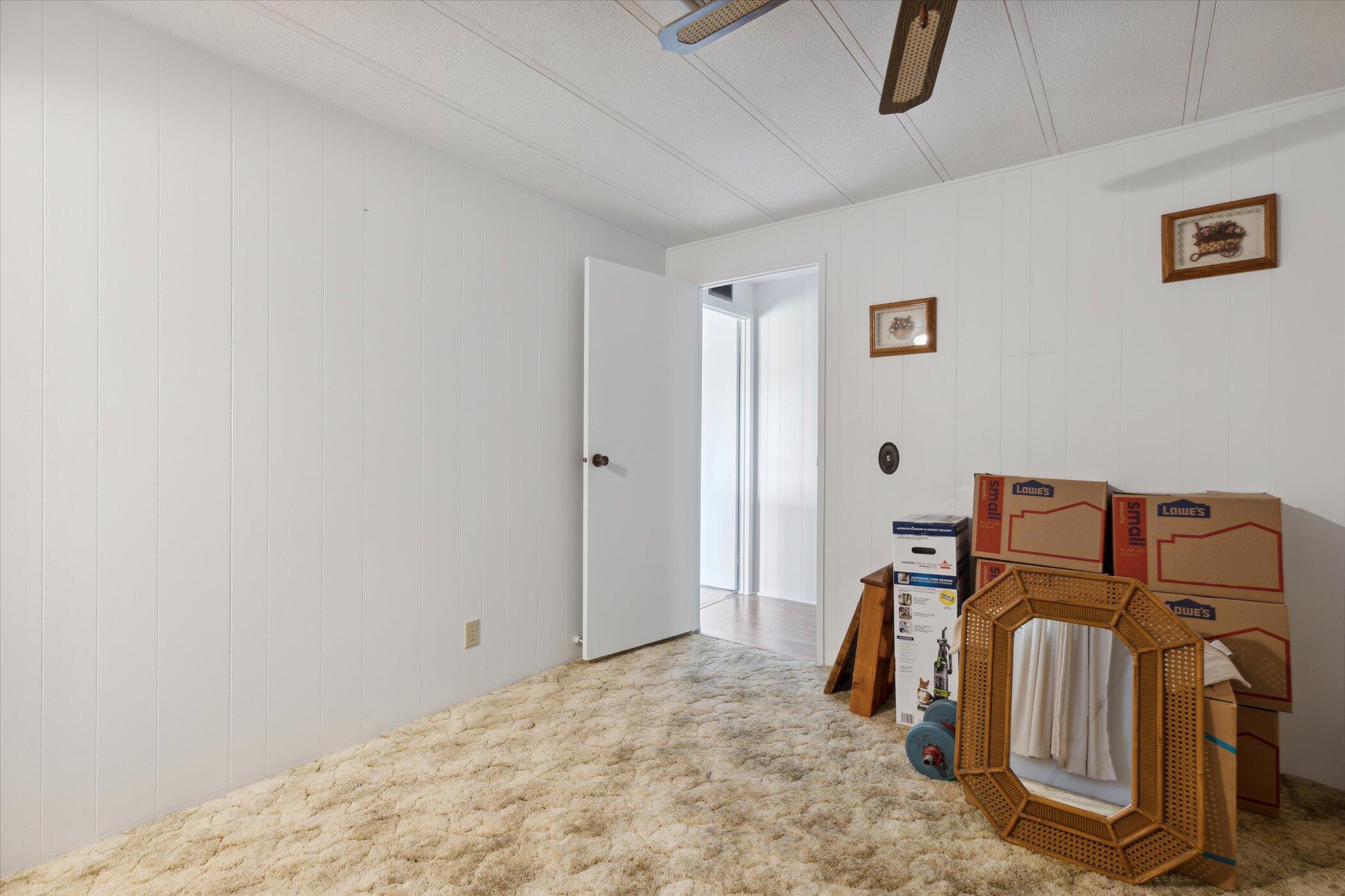 554 Ruth Circle Melbourne, FL 32904 - Photo 26 of 36 a bed room with a bed and a couch