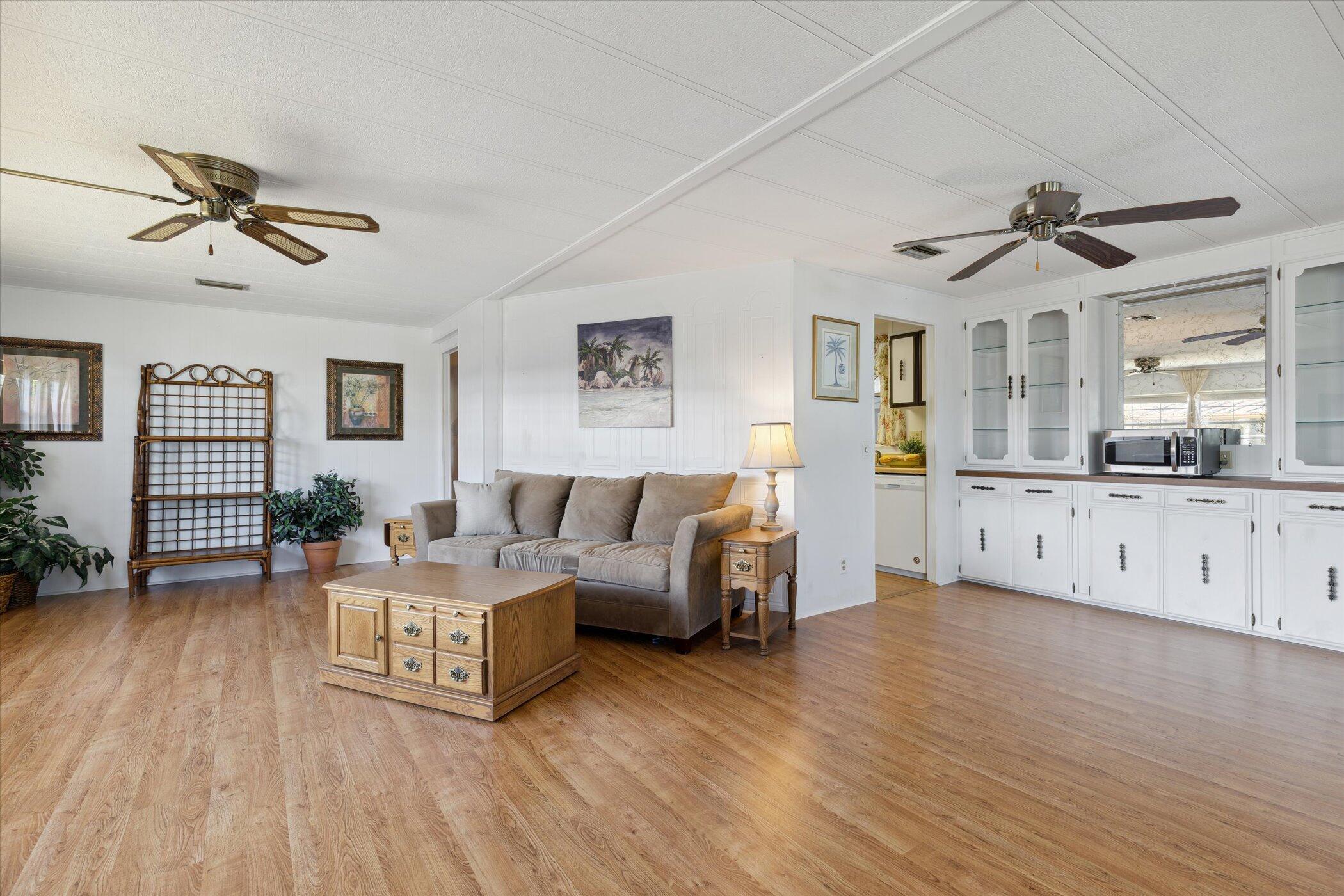 554 Ruth Circle Melbourne, FL 32904 - Photo 6 of 36 a living room with furniture and a wooden floor