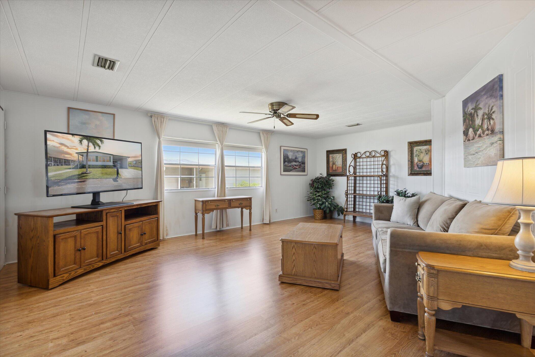 554 Ruth Circle Melbourne, FL 32904 - Photo 7 of 36 a living room with furniture and a flat screen tv
