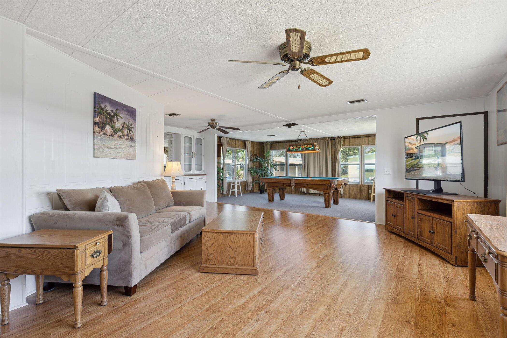 554 Ruth Circle Melbourne, FL 32904 - Photo 8 of 36 a living room with furniture and a wooden floor