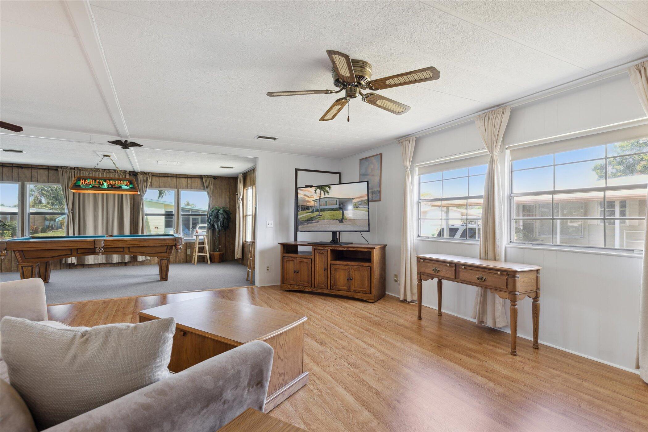 554 Ruth Circle Melbourne, FL 32904 - Photo 9 of 36 a living room with furniture and a wooden floor