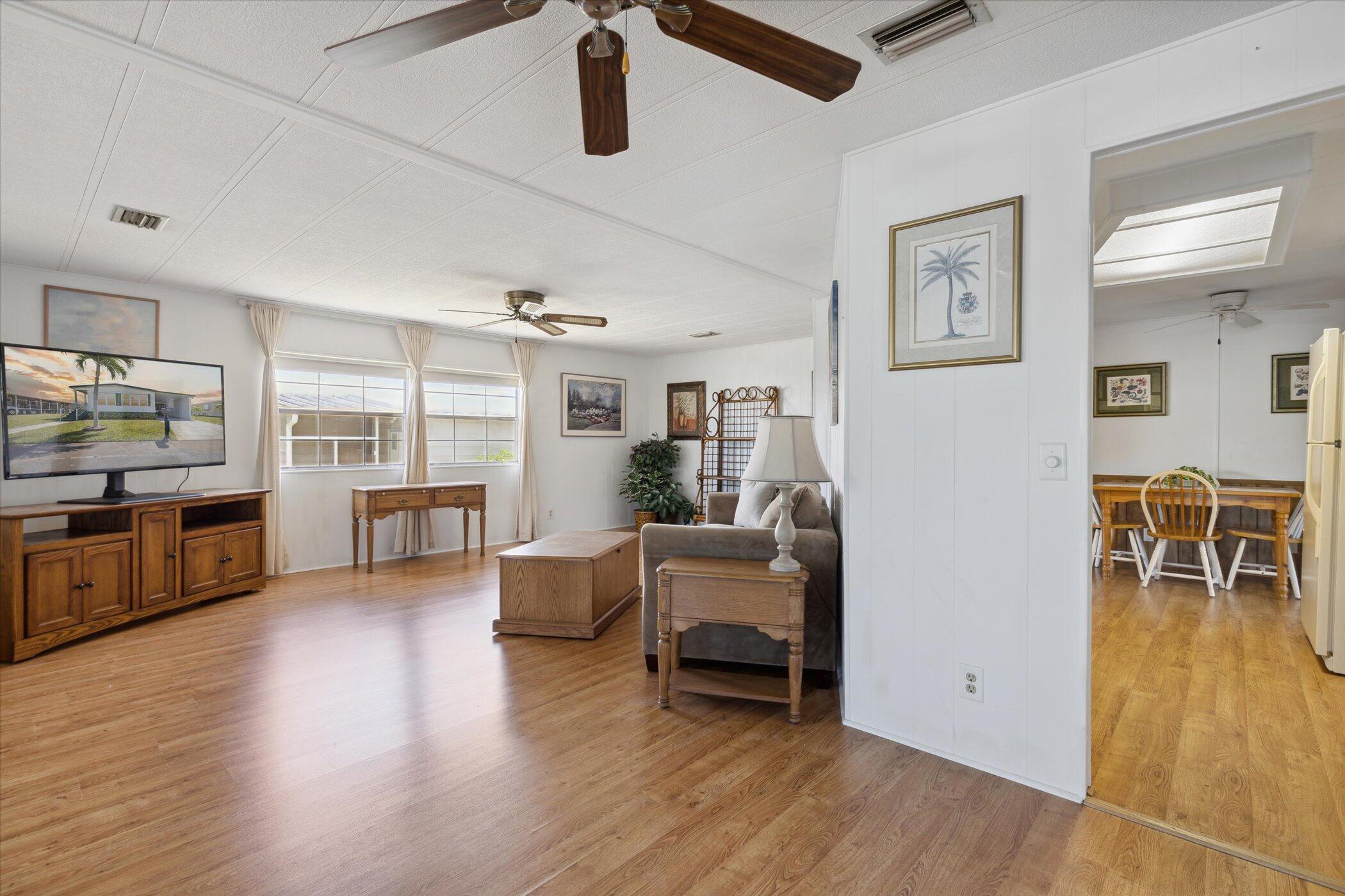 554 Ruth Circle Melbourne, FL 32904 - Photo 10 of 36 a living room with furniture and a flat screen tv
