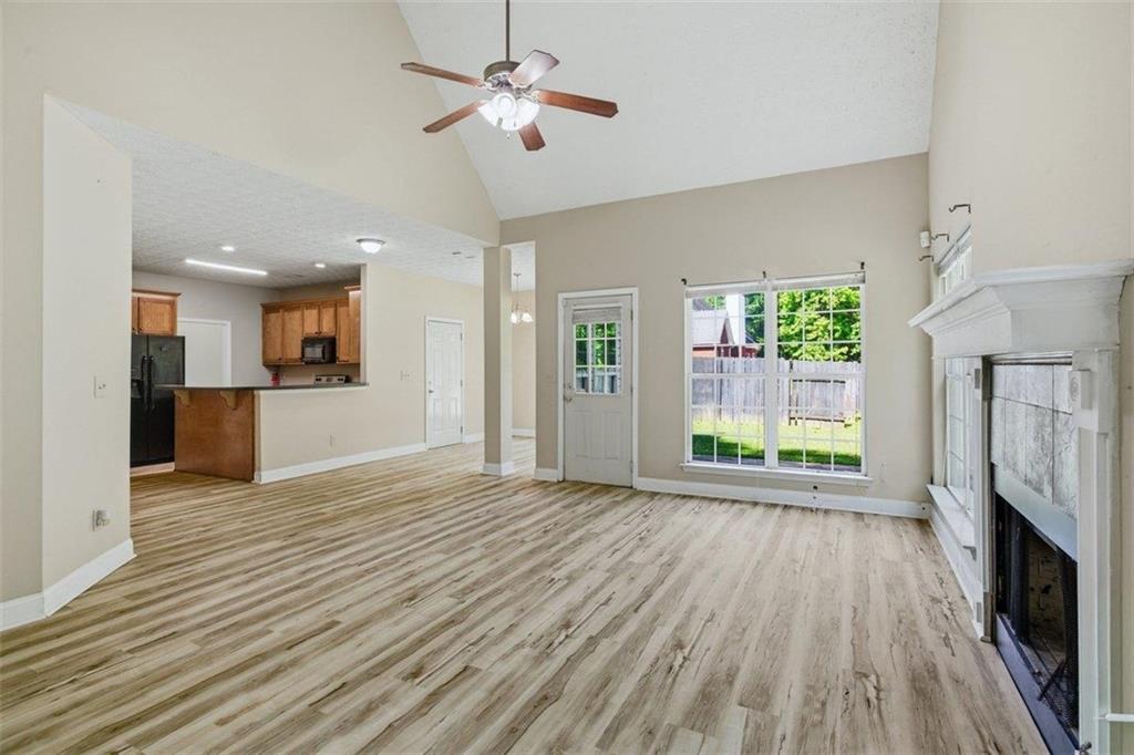 1231 Hillview Road Hampton, GA 30228 - Photo 13 of 49 a view of empty room with wooden floor and fireplace